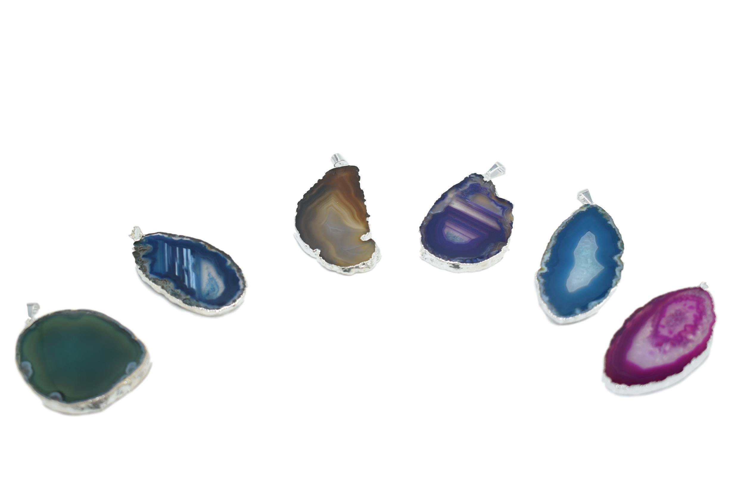 A beautiful Agate Slice Pendant with silver trim, showcasing unique natural patterns and colors, perfect for elegant jewelry collections.