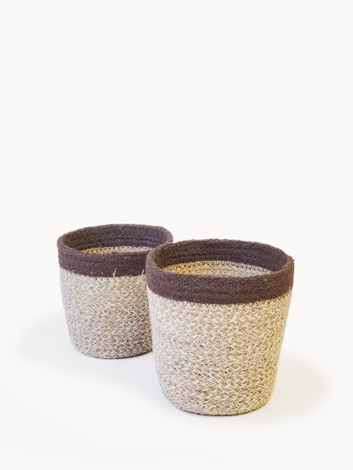 Agora Plant Basket in brown, handcrafted from soft jute yarn, showcasing its natural texture and design.