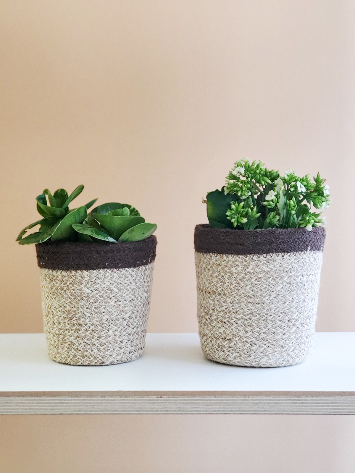 Agora Plant Basket in brown, handcrafted from soft jute yarn, showcasing its natural texture and design.