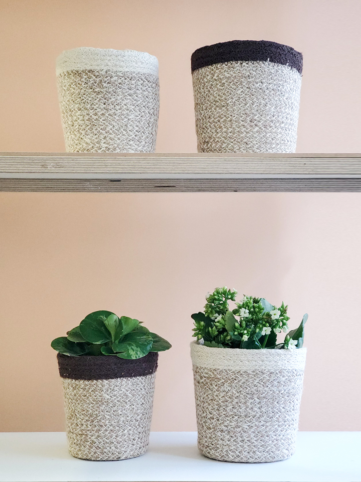 Agora Plant Basket in brown, handcrafted from soft jute yarn, showcasing its natural texture and design.