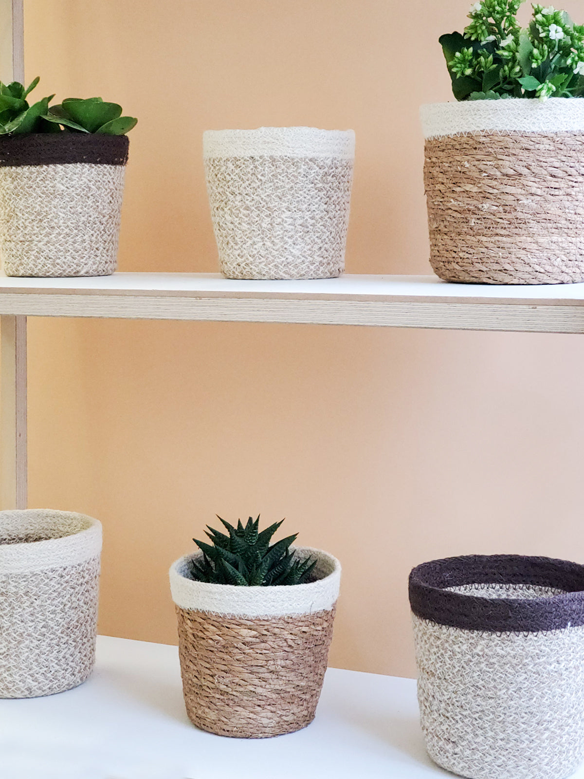 Agora Plant Basket in brown, handcrafted from soft jute yarn, showcasing its natural texture and design.