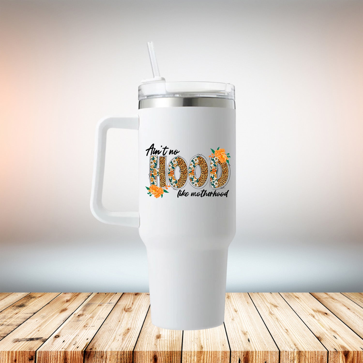 Ain't No Hood Like Motherhood 40oz Travel Mug in white with removable handle and secure lid, perfect for busy moms.