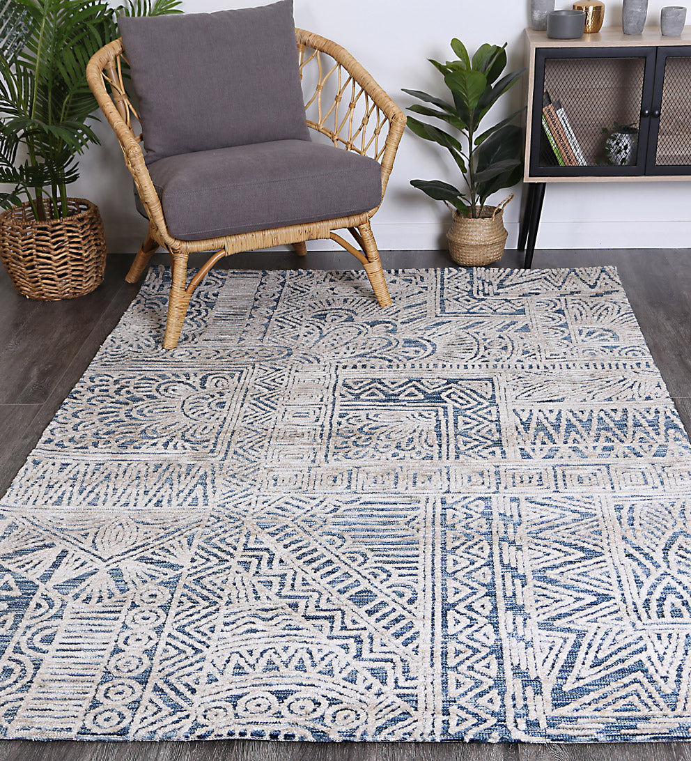 Alayah Navy Flower Rug 160x230 cm featuring geometric patterns in warm colors, hand-tufted wool construction for luxury and comfort.