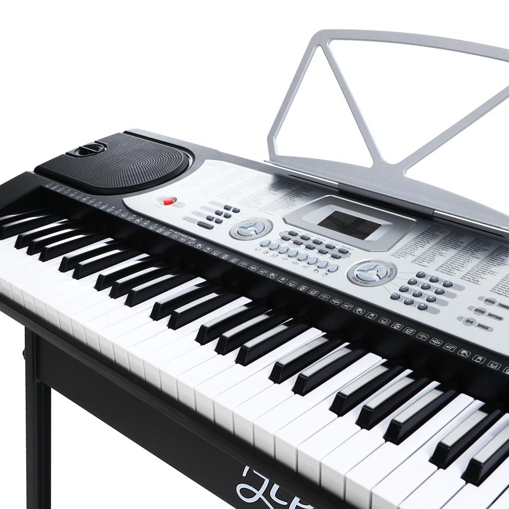 Alpha 61 Keys Electronic Piano Keyboard in silver with LED display, showcasing its keys and features.