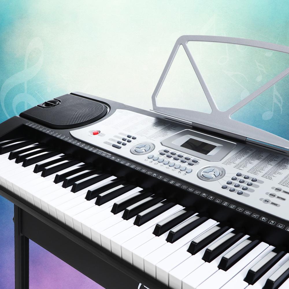 Alpha 61 Keys Electronic Piano Keyboard in silver with LED display, showcasing its keys and features.