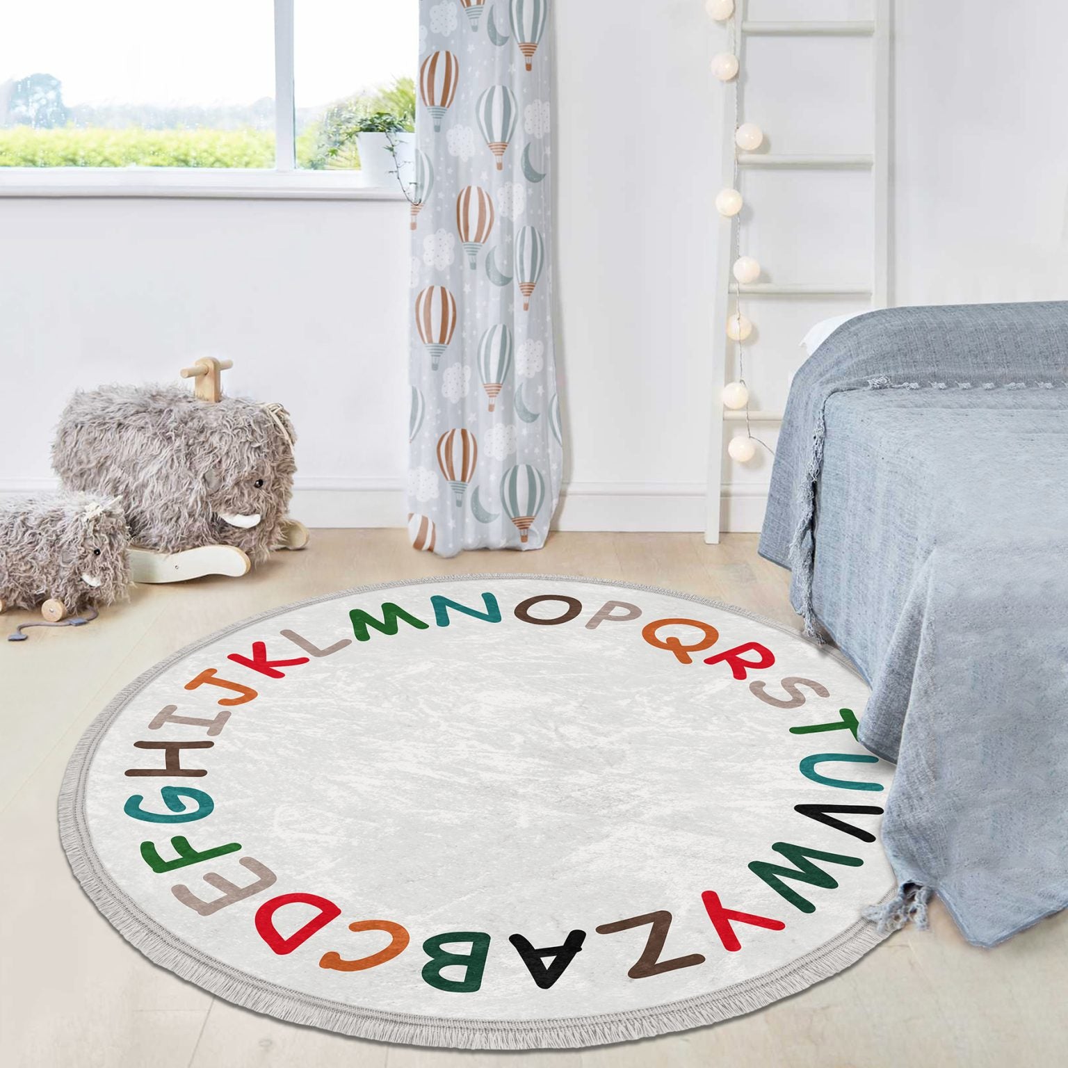 Colorful Alphabet Design Round Rug for Kids Room, featuring soft velvet fabric and fringes, perfect for nursery decor.