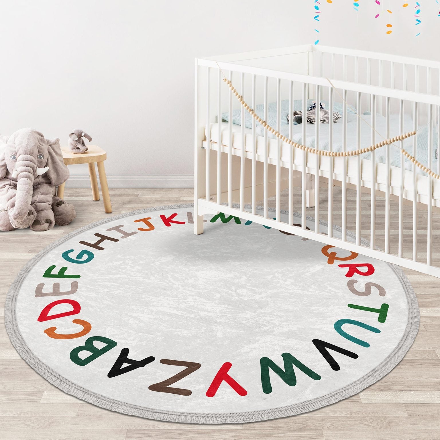 Colorful Alphabet Design Round Rug for Kids Room, featuring soft velvet fabric and fringes, perfect for nursery decor.