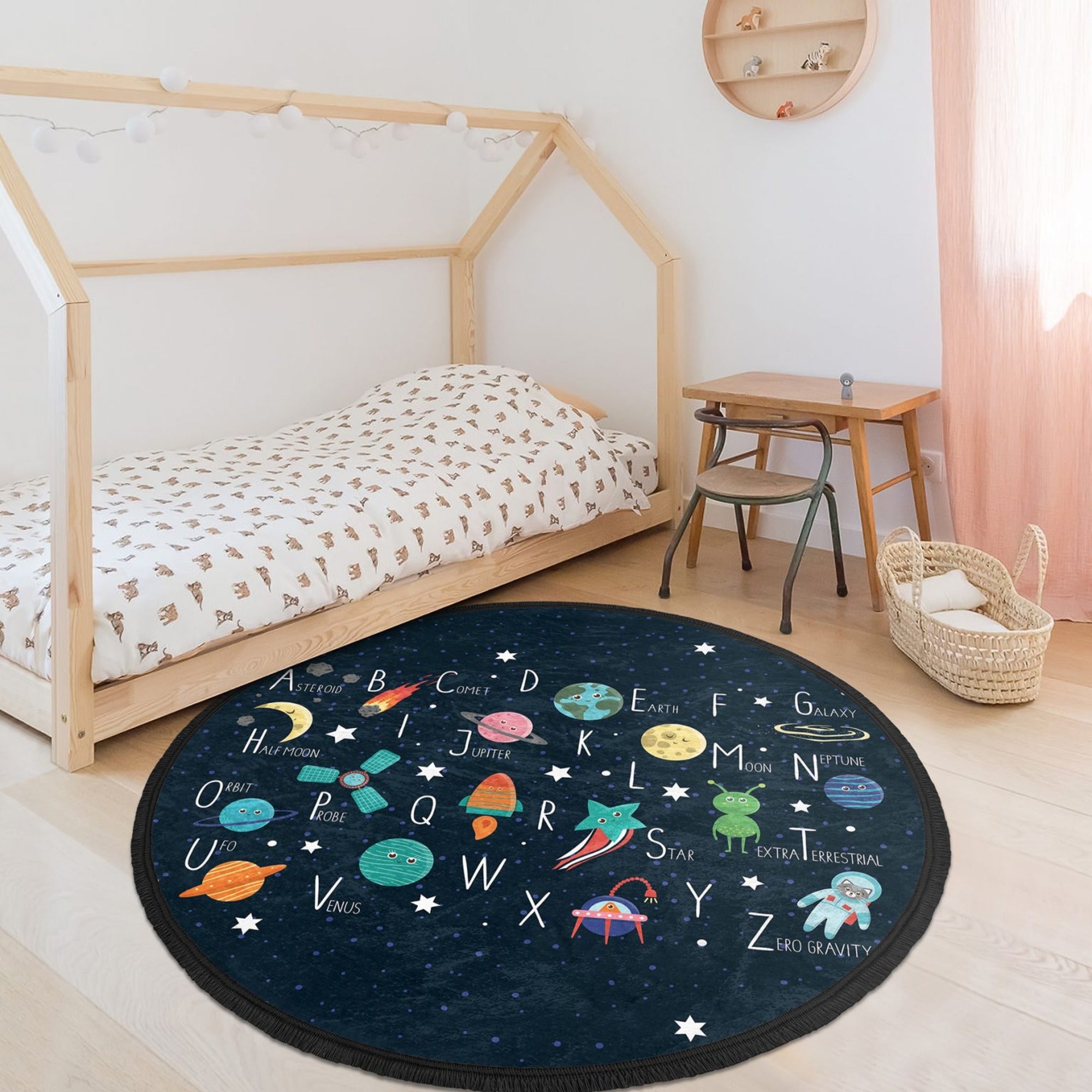 Colorful round area rug featuring alphabet letters and space design, perfect for kids' rooms and nurseries.