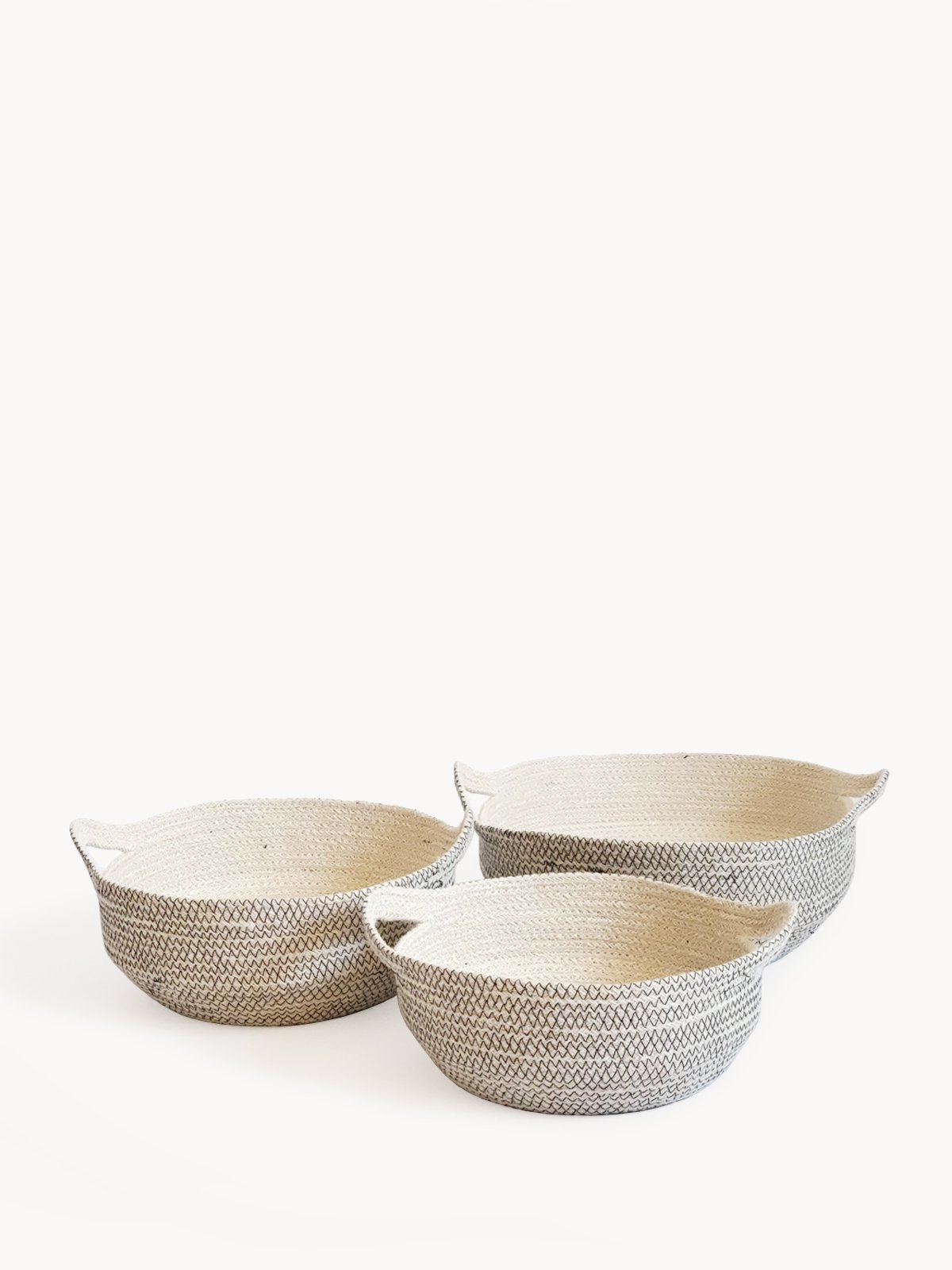 Amari Fruit Bowl in black with off-white jute, handwoven and featuring elegant stitching, perfect for fruit or decorative use.