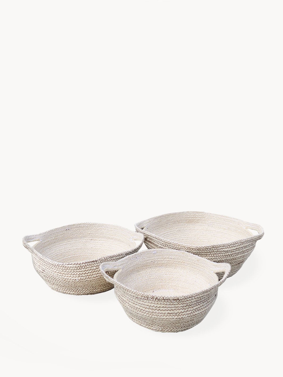 Amari Fruit Bowl in brown, handwoven jute with black stitching, showcasing its elegant design and craftsmanship.