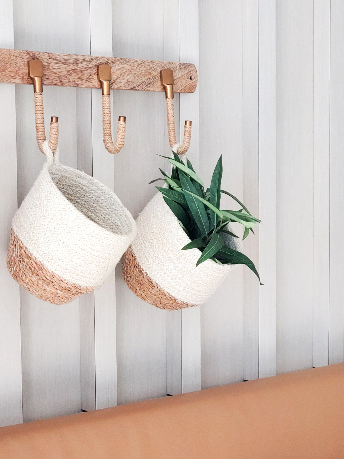 Amari Loop Bin in natural jute and seagrass, showcasing its round shape and off-white color, perfect for stylish storage.