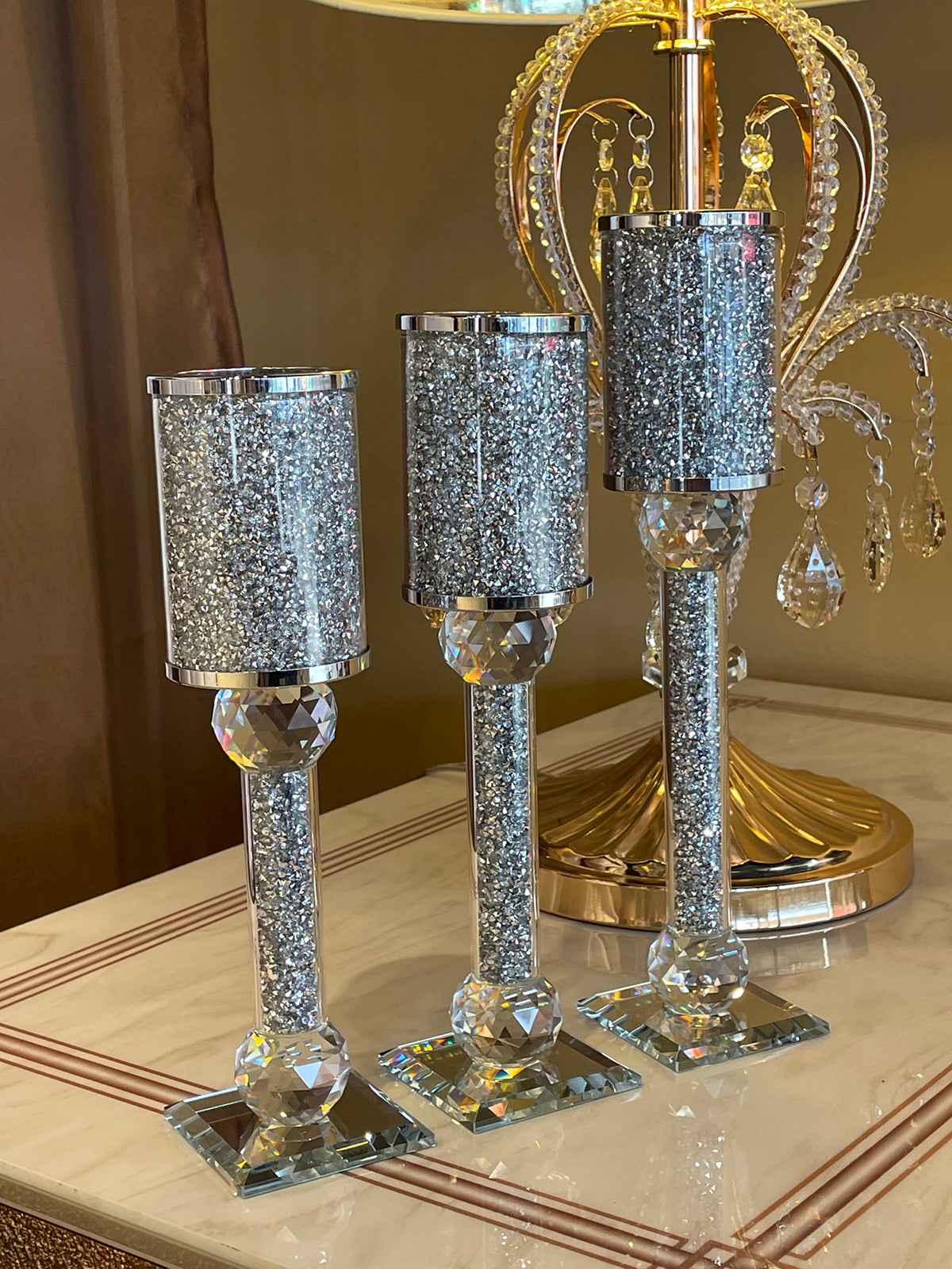 Ambrose 3 Candles Holder Set featuring silver crushed diamonds glass, showcasing three elegant candle holders in varying heights.