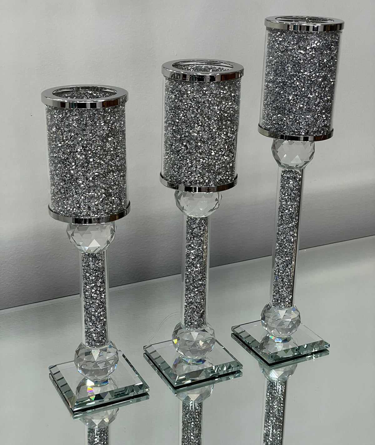 Ambrose 3 Candles Holder Set featuring silver crushed diamonds glass, showcasing three elegant candle holders in varying heights.