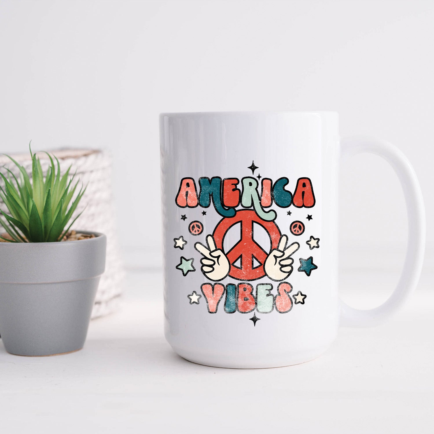 A glossy white ceramic mug with a vibrant America Vibes print, perfect for coffee or tea.