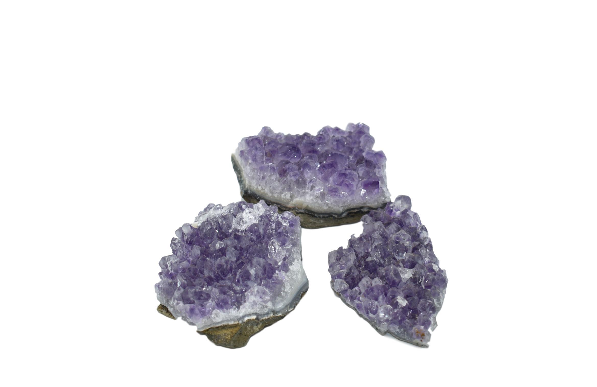 Large, fully formed amethyst chunks from Brazil showcasing deep purple hues and unique geological formations.