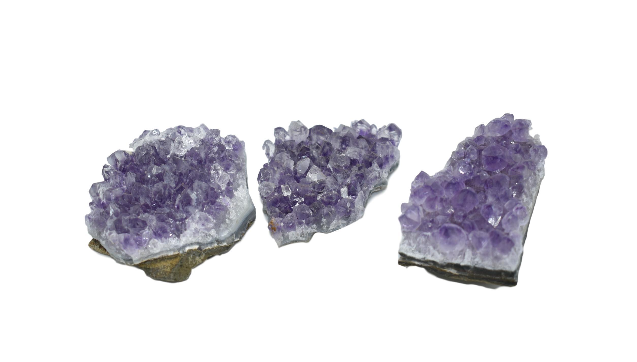 Large, fully formed amethyst chunks from Brazil showcasing deep purple hues and unique geological formations.