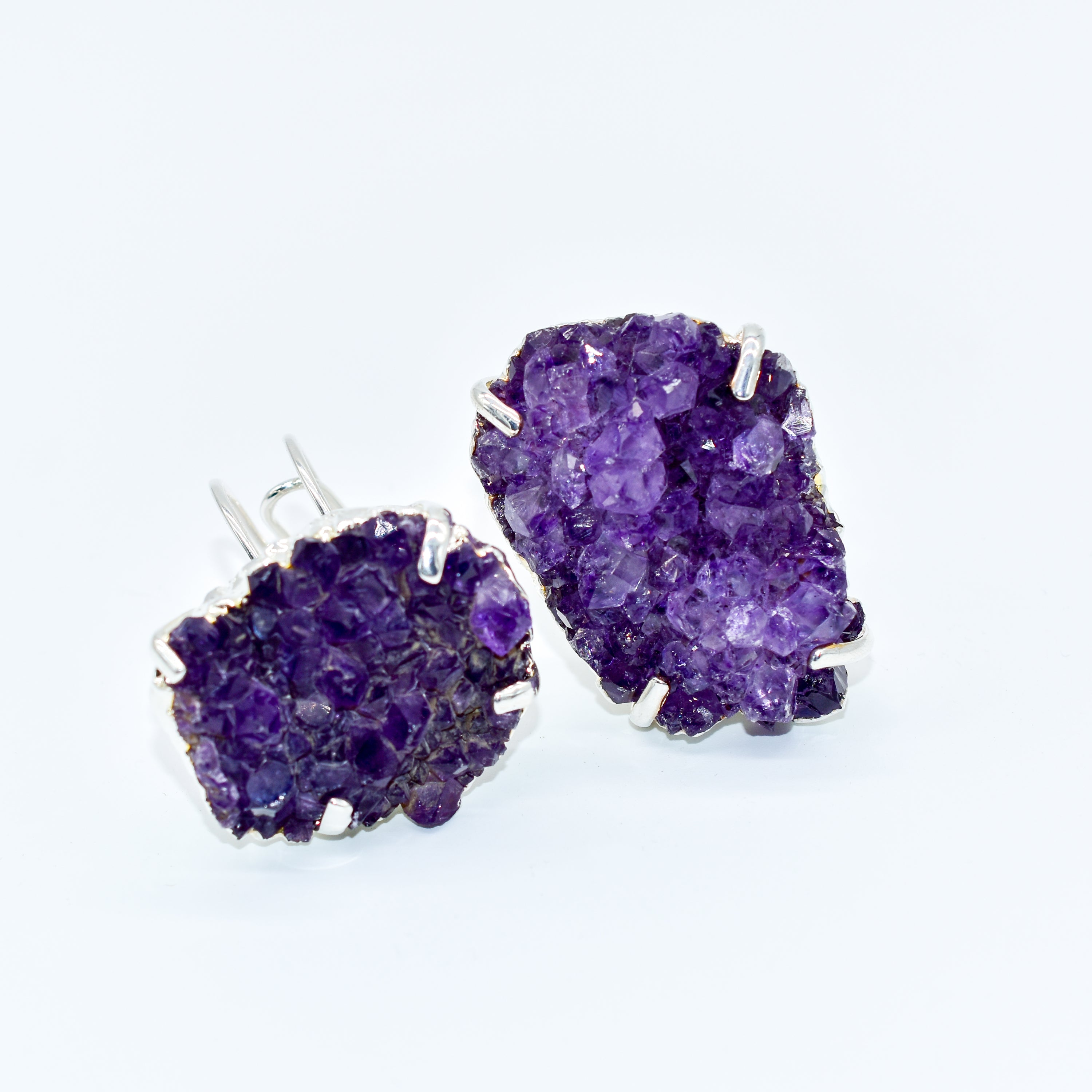 A stunning Amethyst Druzy Ring featuring a natural druzy stone wrapped in silver electroplating, showcasing its unique shape and vibrant color.