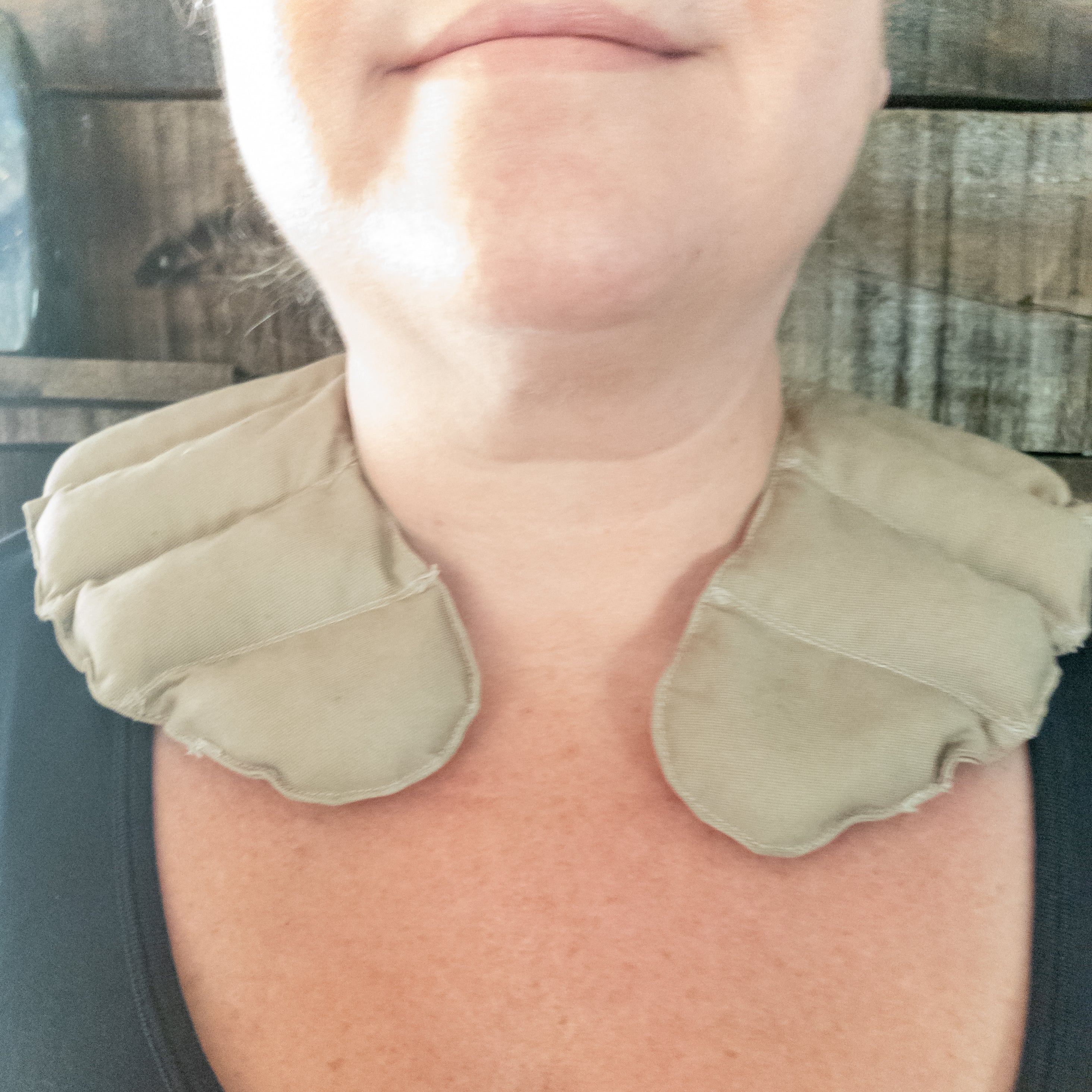 Amethyst Warming Pad featuring a cotton outer shell and filled with natural Amethyst rocks for therapeutic neck and back relief.