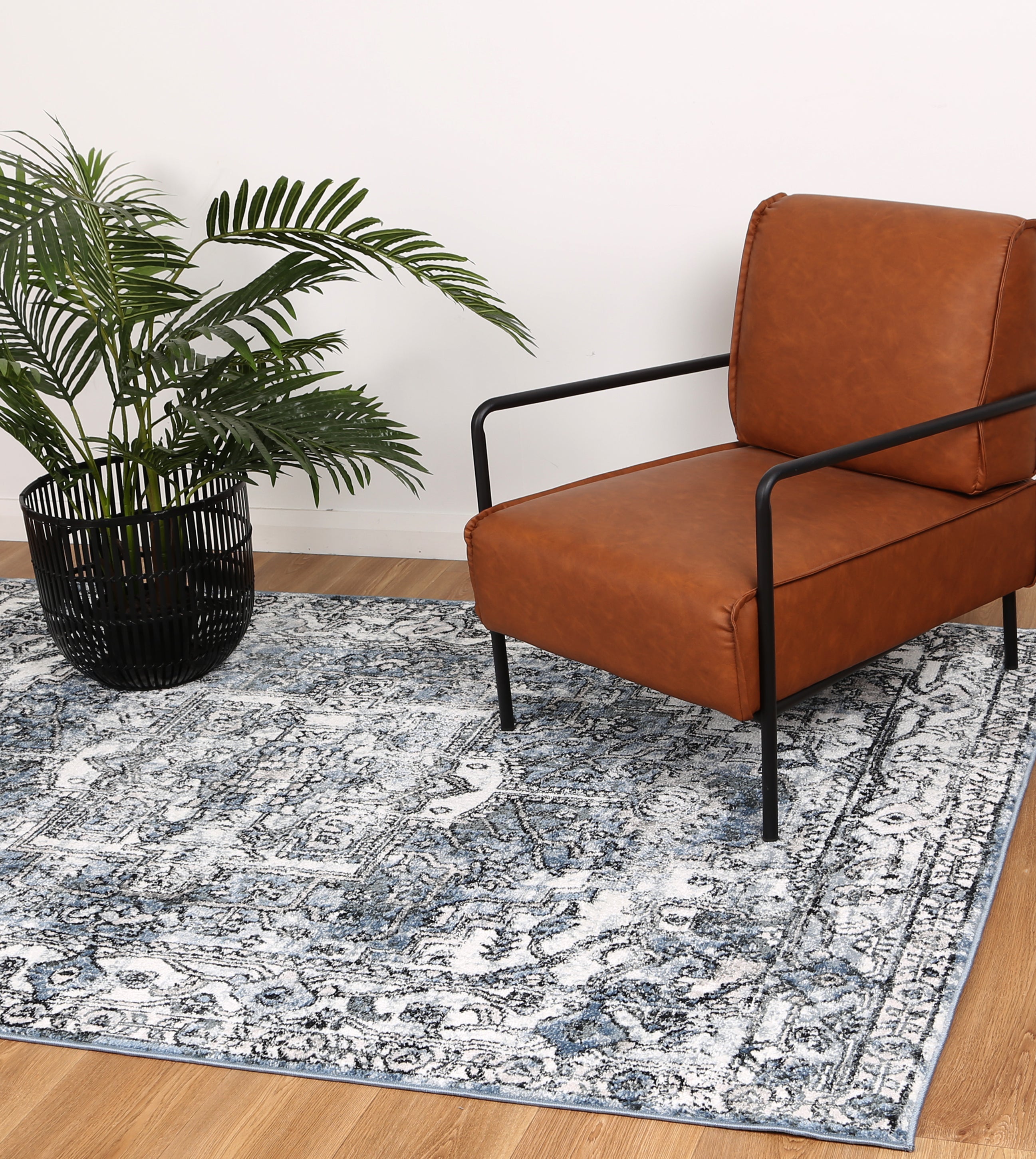 Anatolia Traditional Blue Rug 240x330cm showcasing intricate patterns in black, grey, cream, and terracotta colors, perfect for enhancing home decor.