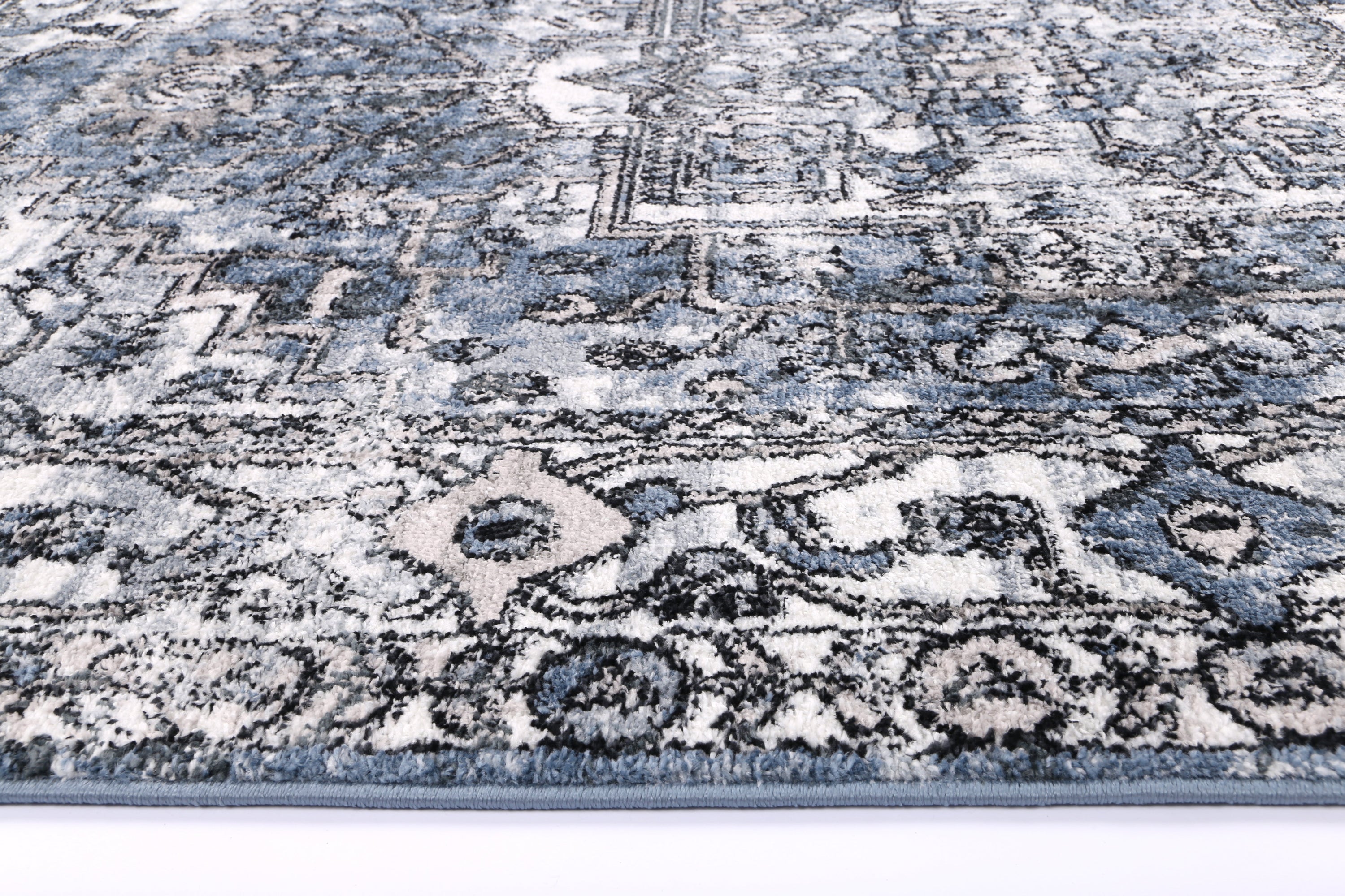 Anatolia Traditional Blue Rug 240x330cm showcasing intricate patterns in black, grey, cream, and terracotta colors, perfect for enhancing home decor.