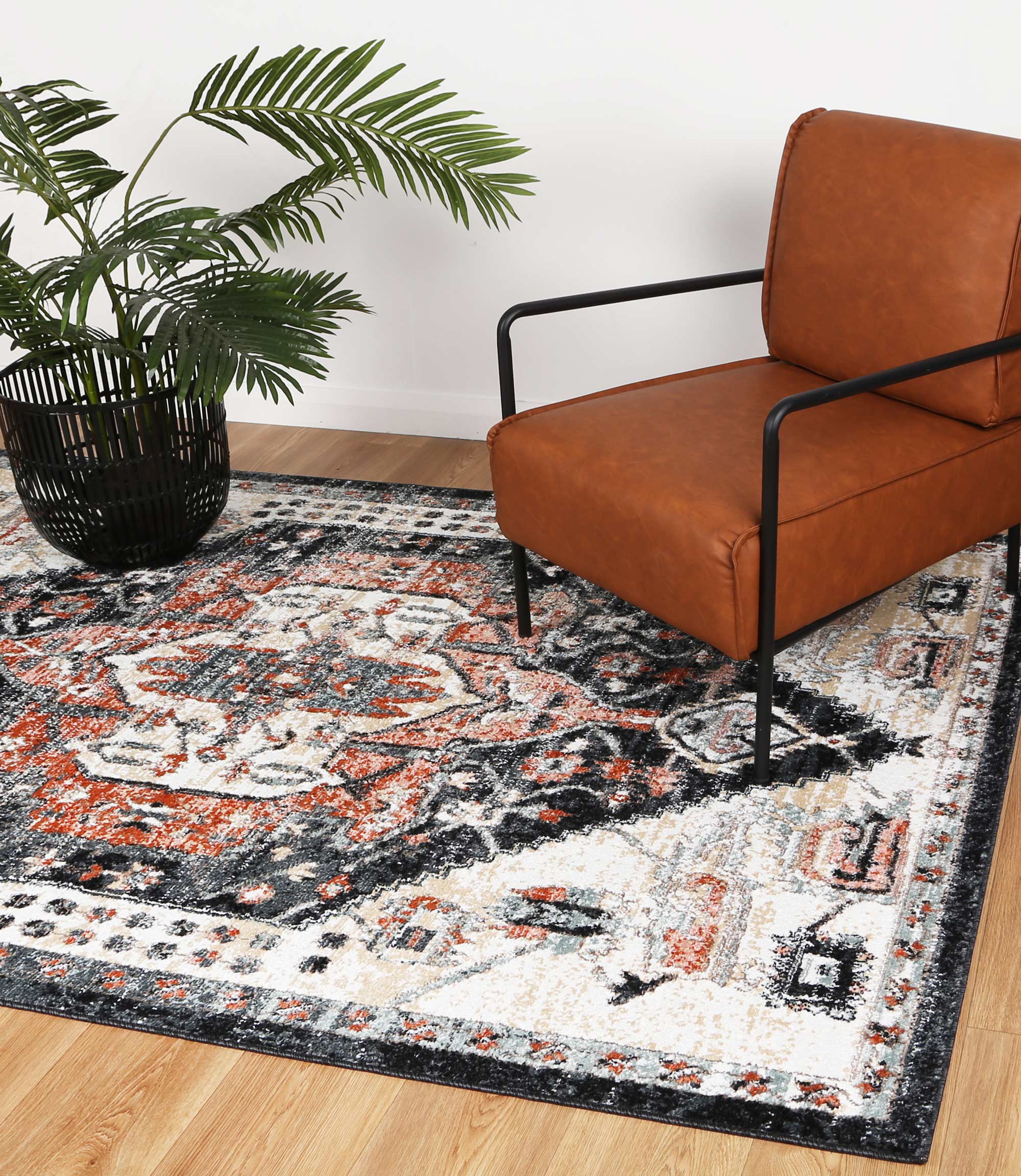 Anatolia Traditional Cream Black Rug 240x330cm showcasing intricate patterns in black, cream, and terracotta colors, perfect for enhancing home decor.