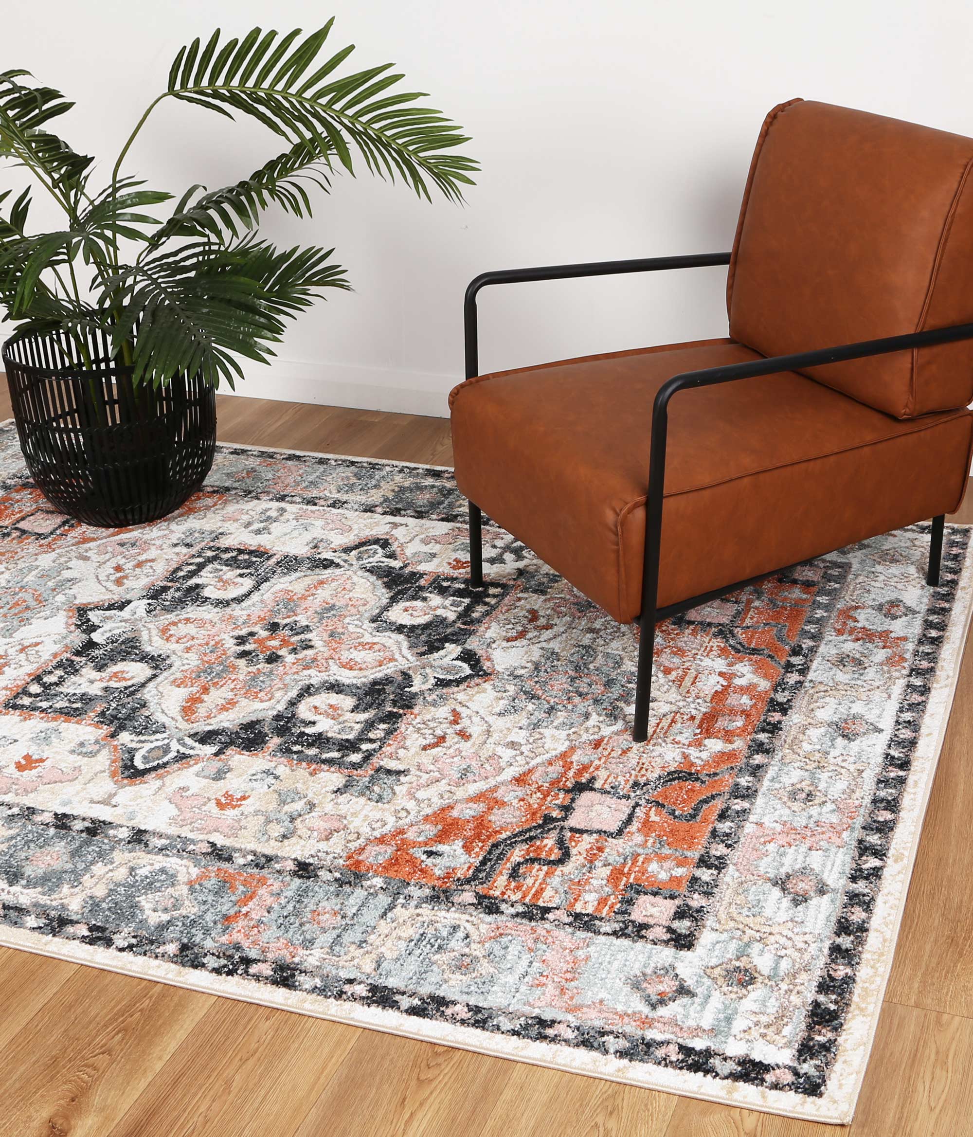 Anatolia Traditional Terracotta Charcoal Rug 240x330cm showcasing intricate patterns in black, grey, cream, and terracotta colors.