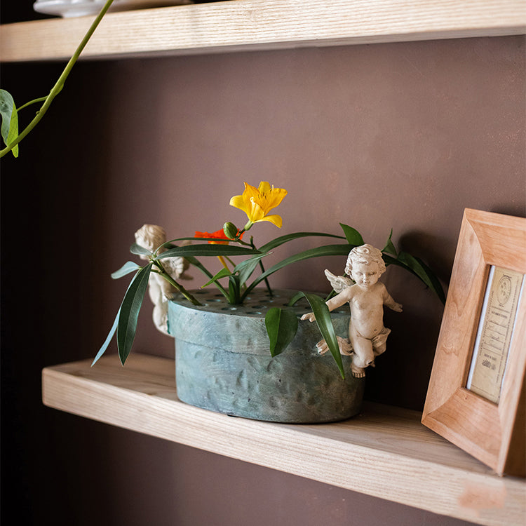 Angel Lotus Pot Flower Arrangement Vase with cherub accents and mint green glaze, perfect for floral displays.