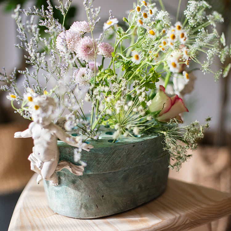 Angel Lotus Pot Flower Arrangement Vase with cherub accents and mint green glaze, perfect for floral displays.