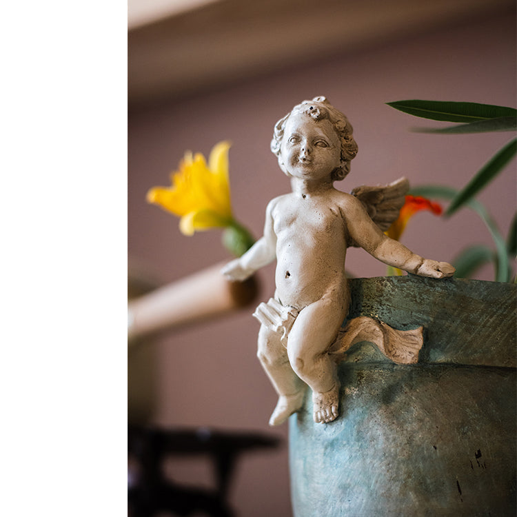 Angel Lotus Pot Flower Arrangement Vase with cherub accents and mint green glaze, perfect for floral displays.