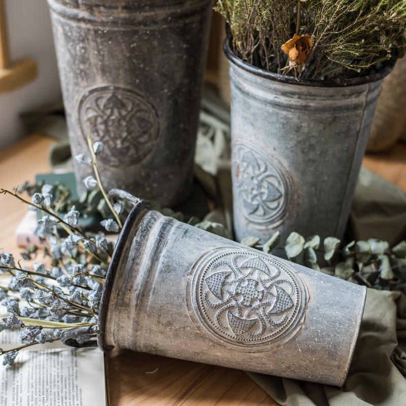 Antique Floral Carving Iron Flower Pot in gray with intricate floral designs, available in three sizes.