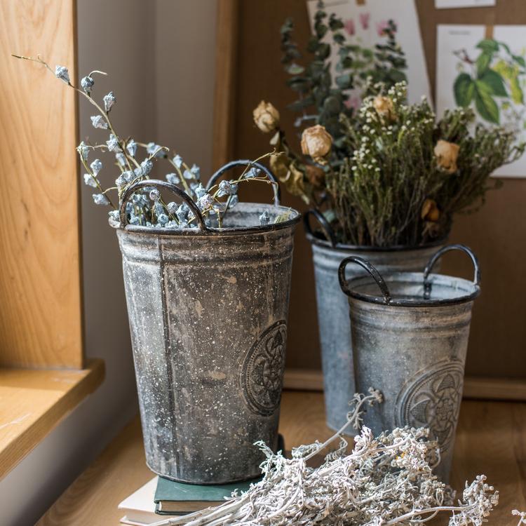 Antique Floral Carving Iron Flower Pot in gray with intricate floral designs, available in three sizes.