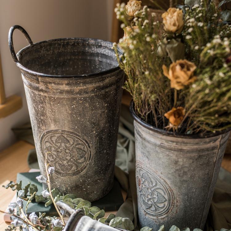 Antique Floral Carving Iron Flower Pot in gray with intricate floral designs, available in three sizes.