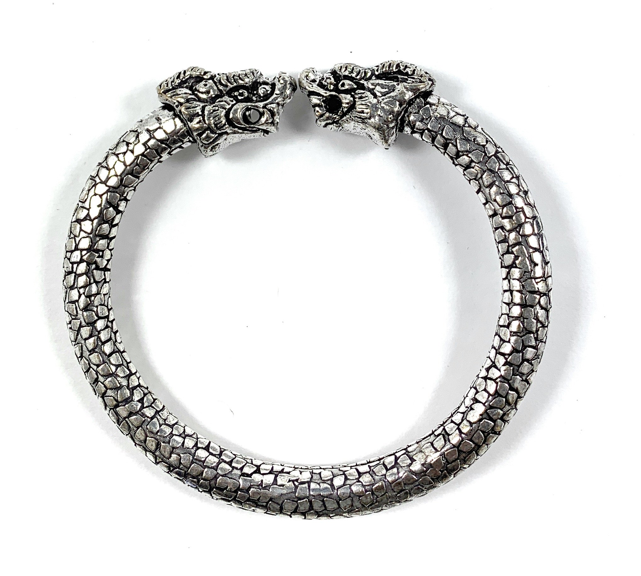 Antique Norse Viking Bracelet featuring two lion heads, showcasing intricate craftsmanship and vintage style.