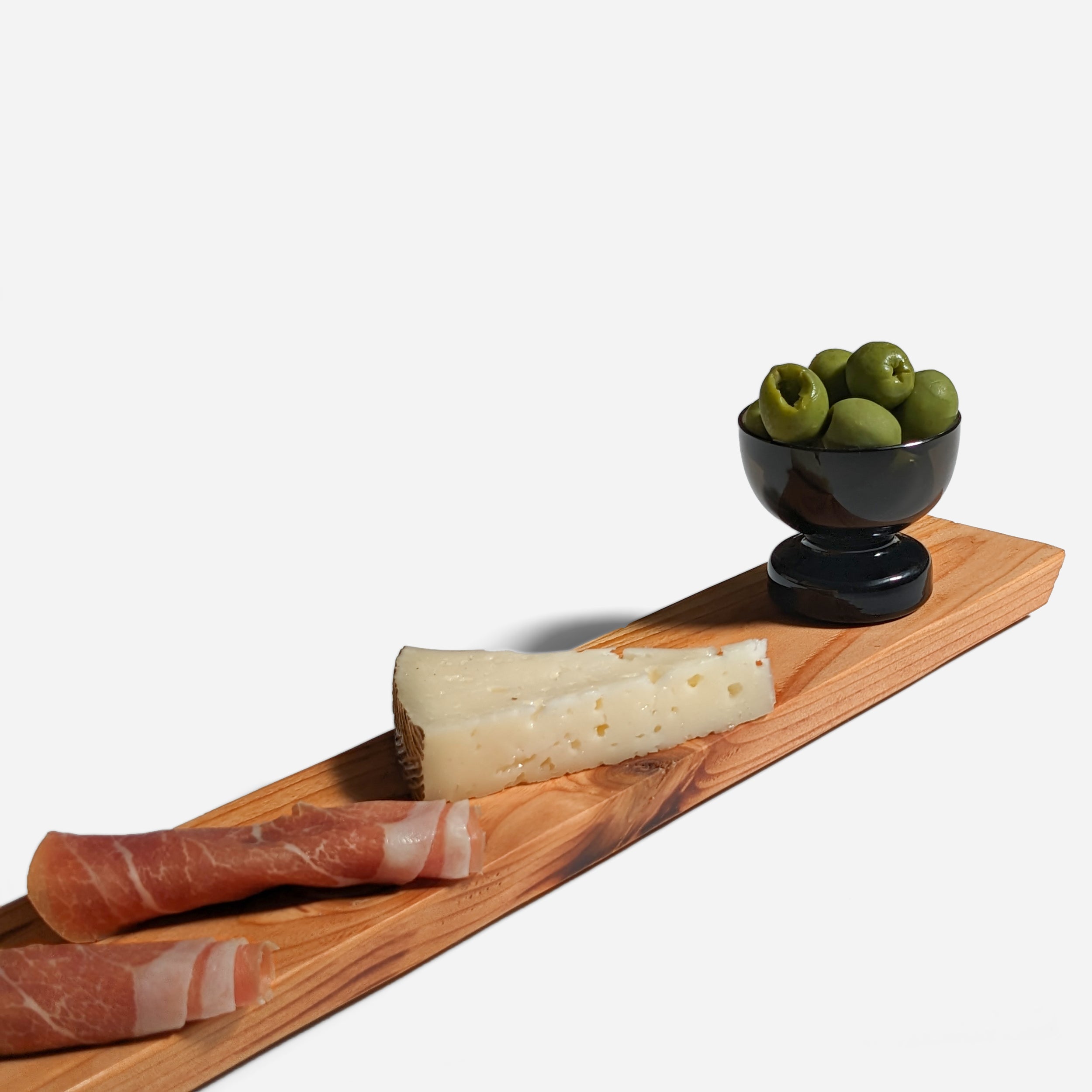 Appy charcuterie board with built-in handle, showcasing natural wood grain and sleek design, perfect for serving appetizers.