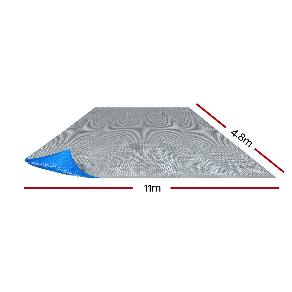 Aquabuddy 11M X 4.8M Solar Swimming Pool Cover in blue with a silver underside, showcasing its bubble design for heat retention.