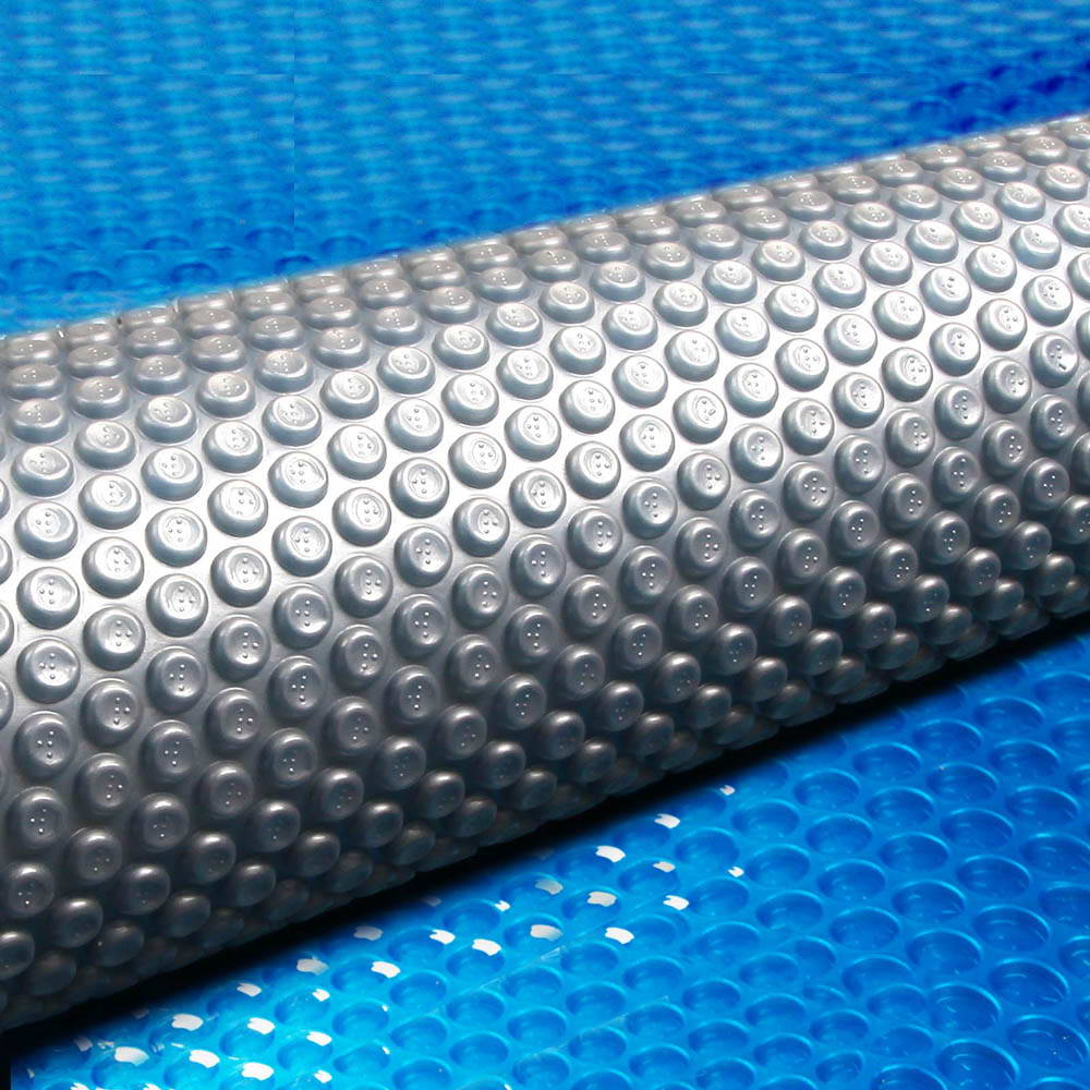 Aquabuddy Solar Swimming Pool Cover measuring 7m x 4m, featuring a blue top and silver underside for optimal heat retention.