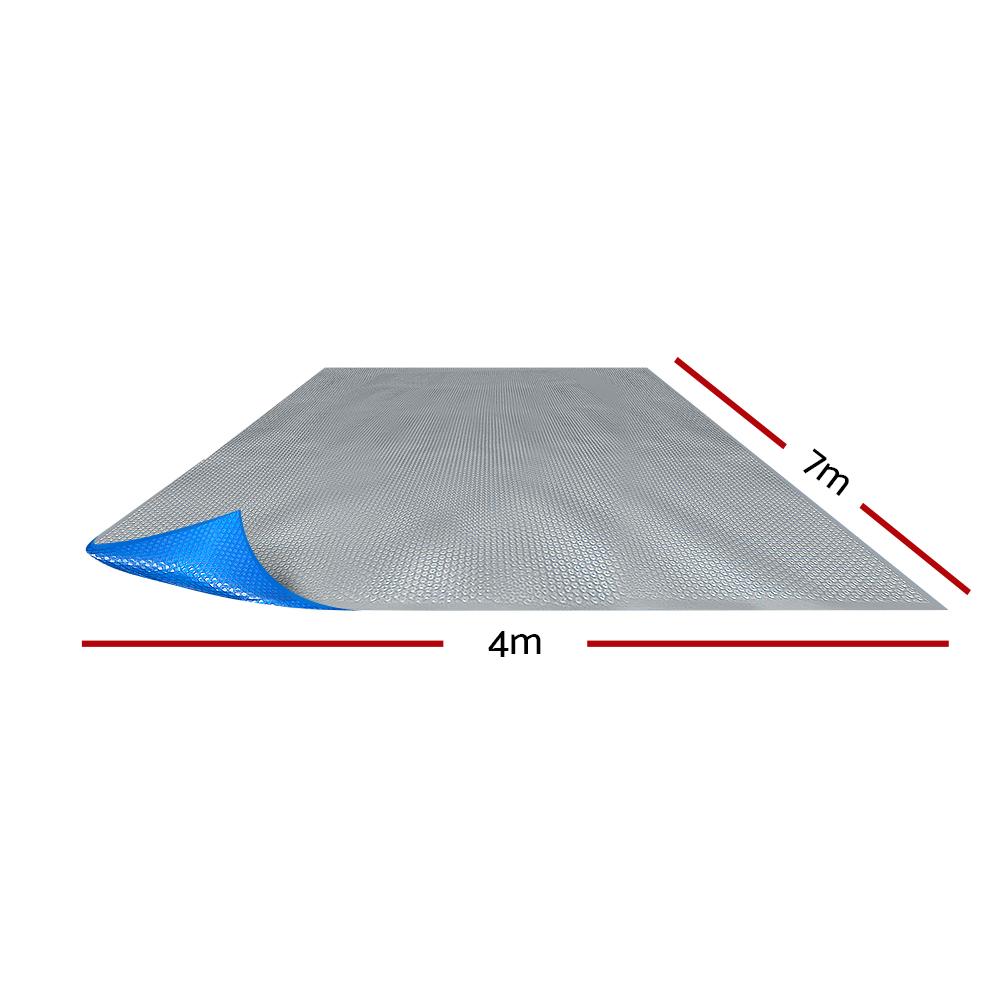 Aquabuddy Solar Swimming Pool Cover 7m x 4m with blue top and silver underside, designed for heat retention and debris prevention.