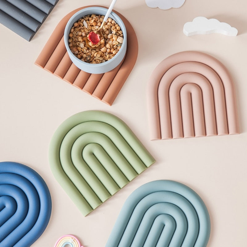 Colorful Arch Silicone Table Mat designed for heat insulation and surface protection, featuring a vibrant rainbow shape.