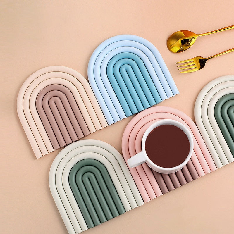 Colorful Arch Silicone Table Mat designed for heat insulation and surface protection, featuring a vibrant rainbow shape.