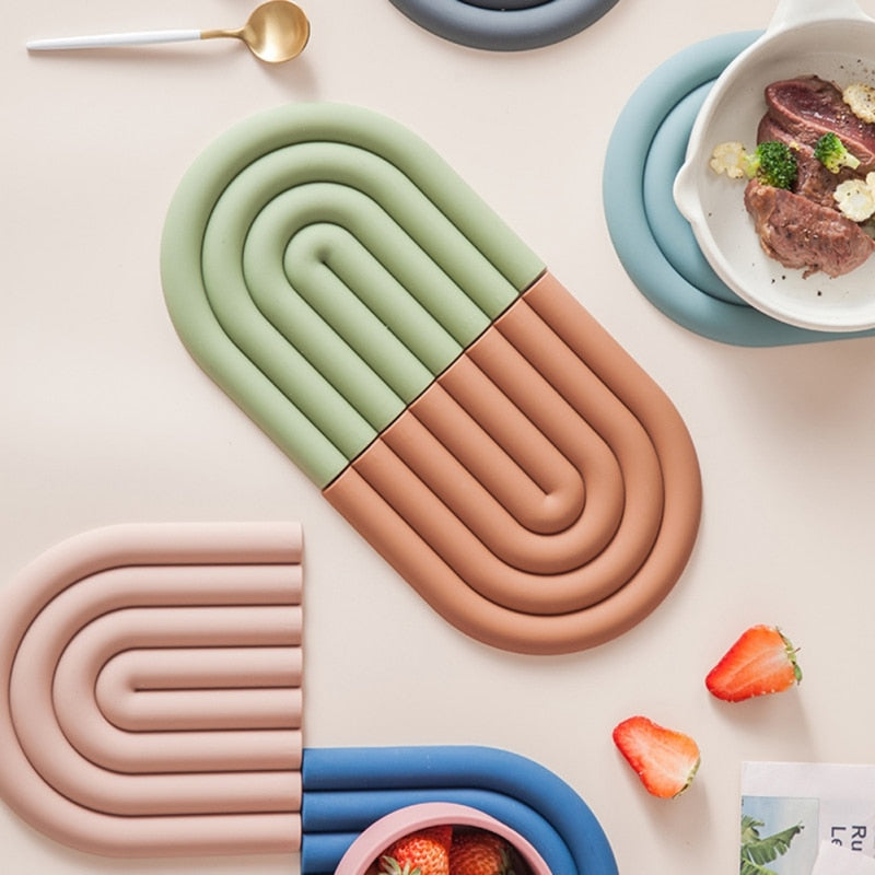 Colorful Arch Silicone Table Mat designed for heat insulation and surface protection, featuring a vibrant rainbow shape.