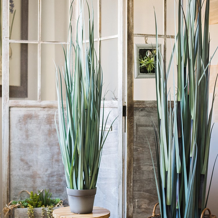 Artificial Bamboo Grass Potted Plant in a gray pot, showcasing realistic green bamboo grass leaves, perfect for indoor decor.