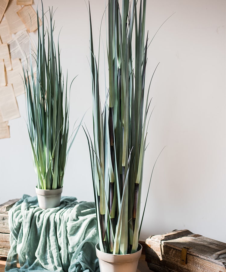 Artificial Bamboo Grass Potted Plant in a gray pot, showcasing realistic green bamboo grass leaves, perfect for indoor decor.