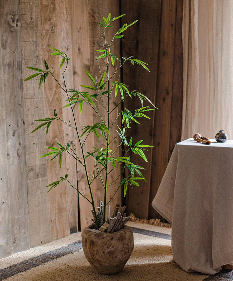 Set of 10 artificial bamboo stems in vibrant green, showcasing realistic design and perfect for home or office decor.