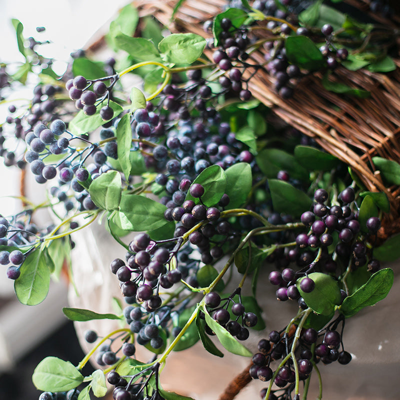 Artificial Blue Snowberry Leaf Stem, 28 inches tall with dark purple berries and green leaves, perfect for home decor.