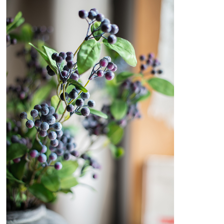 Artificial Blue Snowberry Leaf Stem, 28 inches tall with dark purple berries and green leaves, perfect for home decor.