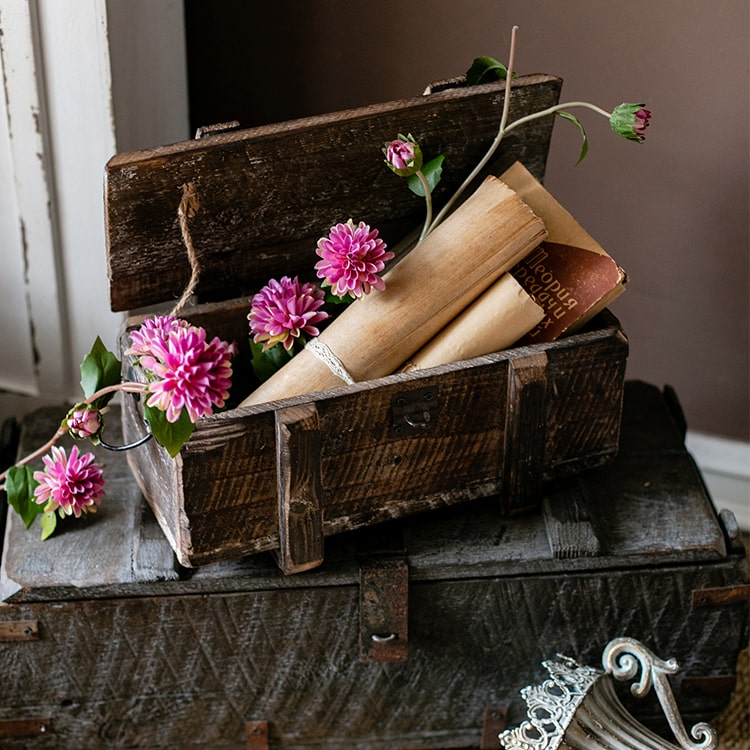 A long artificial chrysanthemum flower vine in rose color with green leaves, showcasing realistic silk flowers.