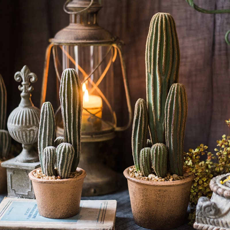 Artificial faux cactus in a brown pot, showcasing realistic green textures and earthy tones, perfect for home or office decor.