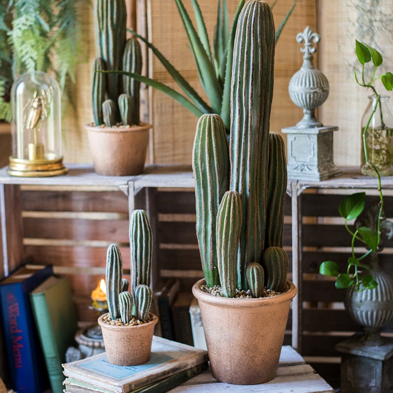 Artificial faux cactus in a brown pot, showcasing realistic green textures and earthy tones, perfect for home or office decor.