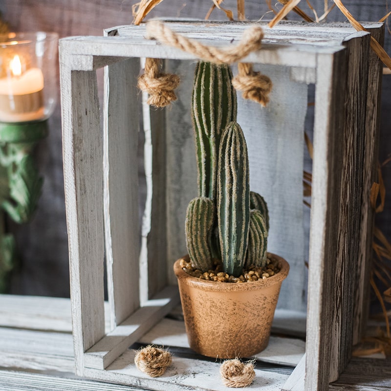 Artificial faux cactus in a brown pot, showcasing realistic green textures and earthy tones, perfect for home or office decor.