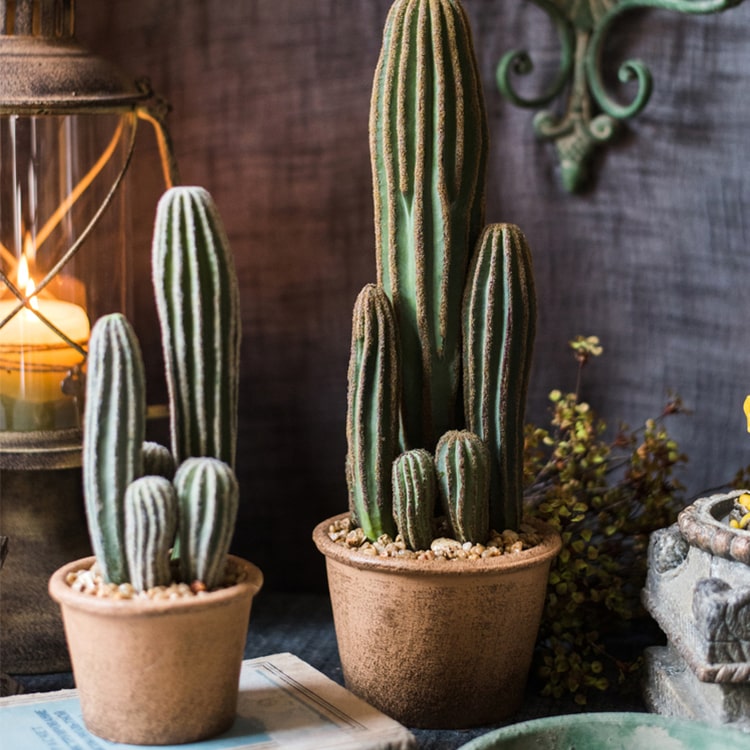 Artificial faux cactus in a brown pot, showcasing realistic green textures and earthy tones, perfect for home or office decor.